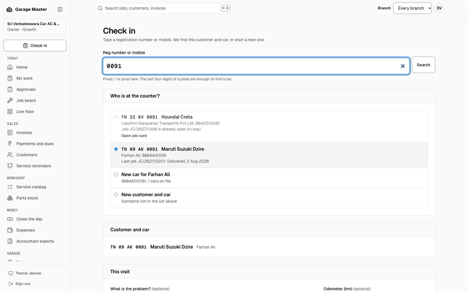 Garage Master check-in screen with a registration search and customer and vehicle fields, using synthetic records.